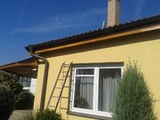 Nátěr dřevěných podhledů a štítů rodinného domu Praha